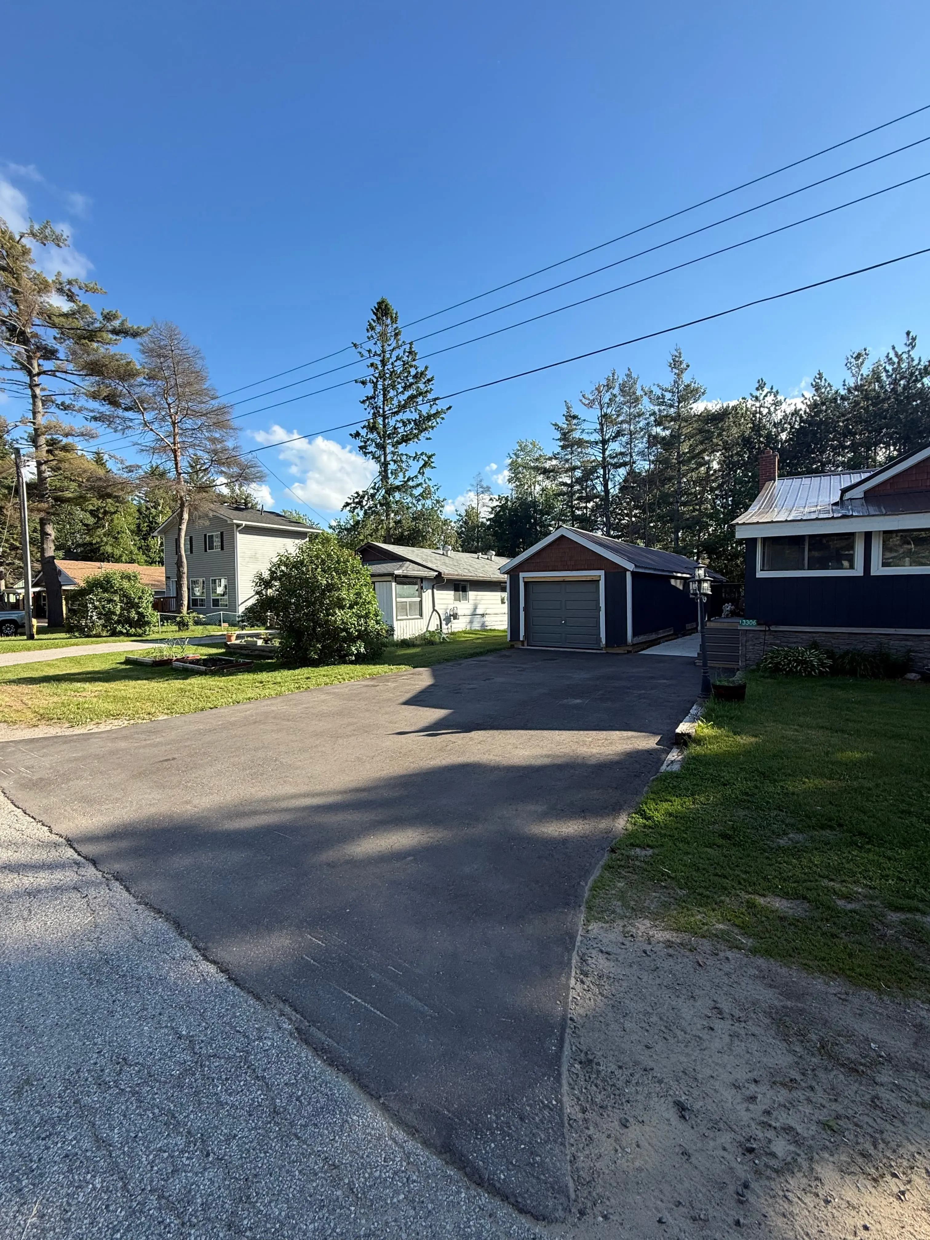 Before driveway sealing at a residential driveway in Orillia, ON.